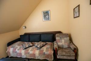 Postel nebo postele na pokoji v ubytování City Center Kaķis B&B