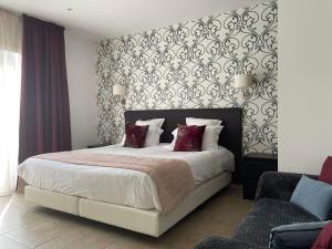 Ένα ή περισσότερα κρεβάτια σε δωμάτιο στο Hotel & Restaurant Les Bergeries d'Alata +65 φωτογραφίες