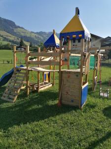 a set of playground equipment in the grass at Appartment Martin in Westendorf