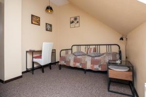 Postel nebo postele na pokoji v ubytování City Center Kaķis B&B
