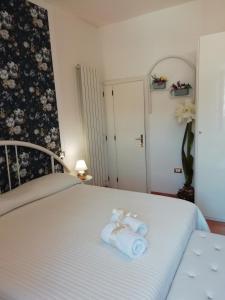 a bedroom with a bed with towels on it at Le Pinelle in Terni +20 photos