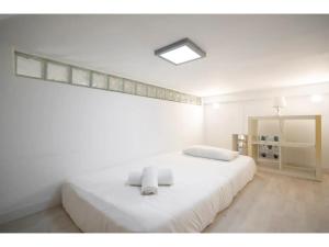 Ein Bett oder Betten in einem Zimmer der Unterkunft Espacioso Loft en Ponzano-Chamberí– Madrid