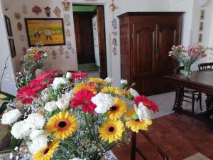 a large bouquet of flowers in a room at Anticadimora Dei Pepe in Salve