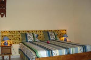 En eller flere senge i et værelse på Bolongs Passion