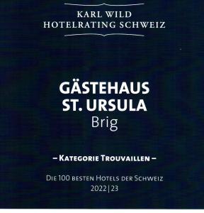 un cartel de un hotel con las palabras catastrófico st en Gästehaus St. Ursula en Brig