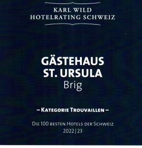 ein Plakat für ein Hotel mit den Worten katastrophal st in der Unterkunft Gästehaus St. Ursula in Brig