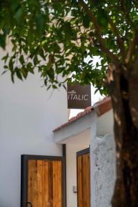 a sign on the top of a building with two doors at Villa Italic in Antalya