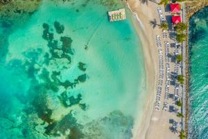 an overhead view of a beach and the ocean at La Creole Beach Hotel & Spa in Le Gosier