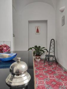 a kitchen with a counter top with a tea kettle on a table at R&D Rest and Dream Capri in Anacapri