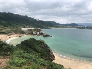 a view of a beach with rocks and the ocean at Porto de Espasante -Severino Blanco in O Porto de Espasante
