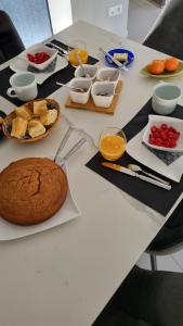 a white table with food on top of it at Les Moineaux de Crussol in Guilherand +16 photos