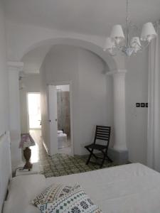 A bed or beds in a room at R&D Rest and Dream Capri