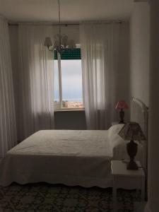 A bed or beds in a room at R&D Rest and Dream Capri