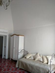 A bed or beds in a room at R&D Rest and Dream Capri