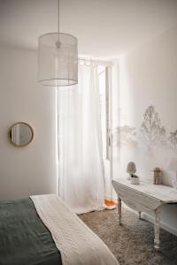 Łóżko lub łóżka w pokoju w obiekcie Maison 15