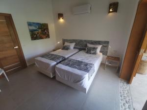 Postel nebo postele na pokoji v ubytování Flor de Coco, Villa neuve, 5 chambres, 5 salles de bains et grande piscine à 250 mètres de la plage