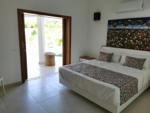 Postel nebo postele na pokoji v ubytování Flor de Coco, Villa neuve, 5 chambres, 5 salles de bains et grande piscine à 250 mètres de la plage
