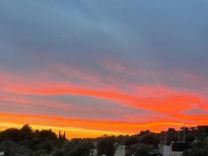 The sunrise or sunset as seen from a panziókat or nearby