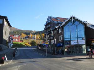an empty street in a small town with buildings at Bubblans Apartments in Åre