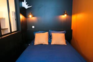 En eller flere senge i et værelse på Le Zèbre, T1 hypercentre chic et cosy, Wifi par SOVALFI