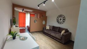 a living room with a couch and a table at Apartments Radovic in Petrovac na Moru