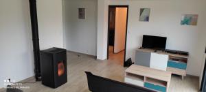 Et tv og/eller underholdning på Gite touristique l'épuisette