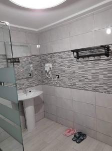 a bathroom with a sink and a shower at Almarsa1 in Al Hoceïma +15 photos