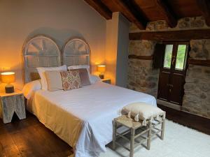 Ліжко або ліжка в номері El Jardin de las Magnolias Hotel