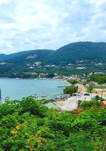 a view of a beach next to a body of water at Peyko Rooms in Keri