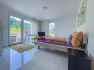 Ένα ή περισσότερα κρεβάτια σε δωμάτιο στο Belair Beinwil - B&B