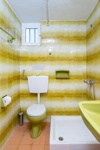 a bathroom with a toilet and a sink at panorama view apartment in Sitia +44 photos