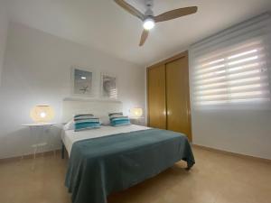 Säng eller sängar i ett rum på CABO BEACH II