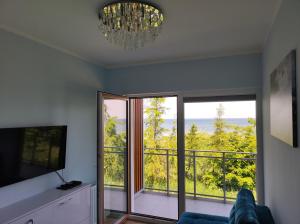 TV a/nebo společenská místnost v ubytování Apartament BalticHoff w Let's Sea Baltic Park Gąski