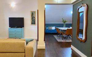 a living room with a couch and a table at Apartments Nautica in Herceg-Novi