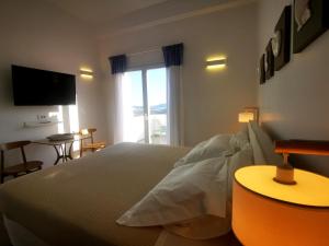 Postel nebo postele na pokoji v ubytování Κallisto rooms