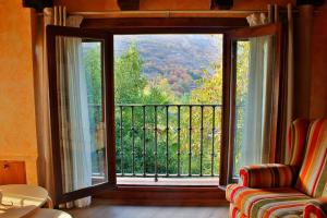a room with a large window with a view at La Casa del Abad in Anguiano