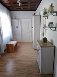 a room with a kitchen with a table and a door at Ferienhaus Savannah in Schützen am Gebirge