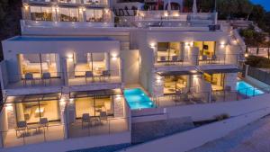 an aerial view of a building at night at Sivota Deamaris Luxury Boutique Hotel in Syvota