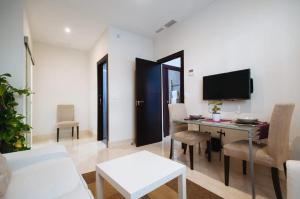 Televízia a/alebo spoločenská miestnosť v ubytovaní Acogedor Apartamento José Laguillo.