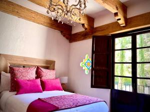Postel nebo postele na pokoji v ubytování Molino de los Reyes By Rotamundos