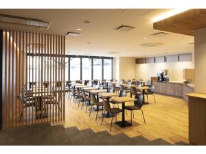a restaurant with tables and chairs in a room at R & B Hotel Kyoto Shijo Kawaramachi - Vacation STAY 40548v in Kyoto