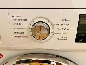 a close up of a washing machine at FeWo Schlösschen #Innenstadt#Garten#ruhige Lage von Harztraveler in Wernigerode