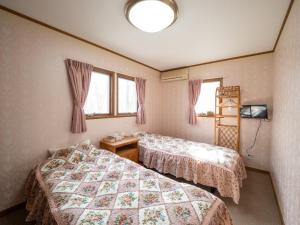 Montania Nasu Grande - Vacation STAY 59678v tesisinde bir odada yatak veya yataklar