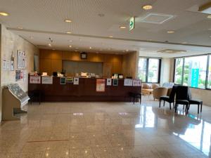 a lobby with a waiting area with chairs and a counter at AZ Inn Obu - Vacation STAY 71878v in Obu