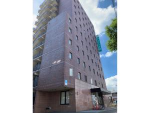 a tall building with a brick facade at AZ Inn Obu - Vacation STAY 71878v in Obu