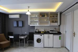 Kuchyň nebo kuchyňský kout v ubytování Arat Apartments