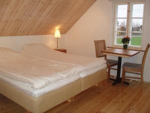 Postel nebo postele na pokoji v ubytování Hoby Gård