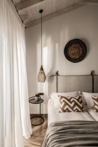 Postel nebo postele na pokoji v ubytování Cossoro Villas Zakynthos