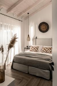 Posteľ alebo postele v izbe v ubytovaní Cossoro Villas Zakynthos + 37 fotografií