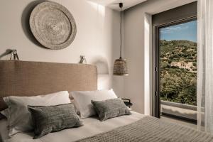 Postel nebo postele na pokoji v ubytování Cossoro Villas Zakynthos
